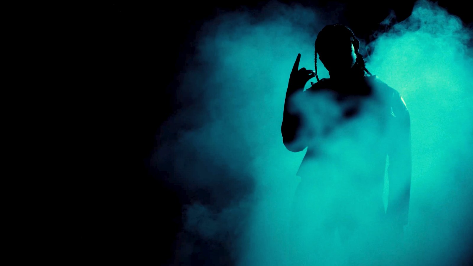 Silhouette in teal smoke