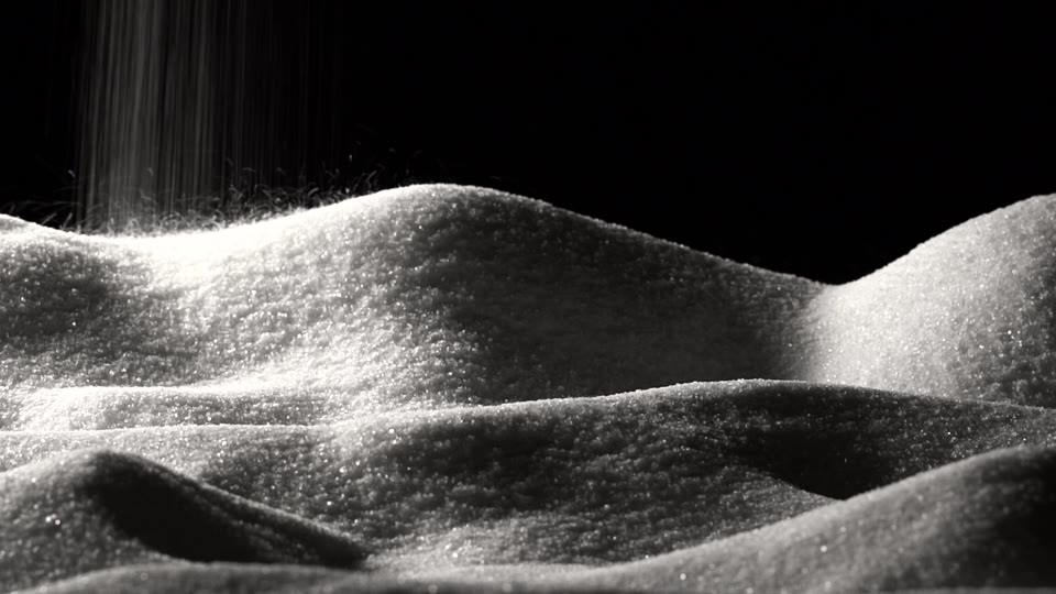 Sand pouring over dunes